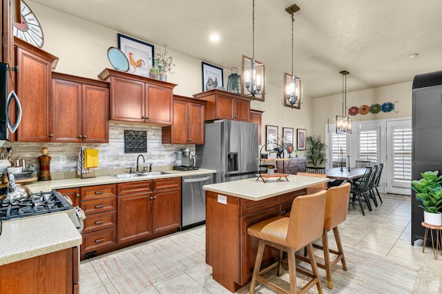 14858 S Ox Cart Ln, Draper, UT 84020 - kitchen featuring appliances with stainless steel finishes, backsplash, light tile patterned floors, and light countertops