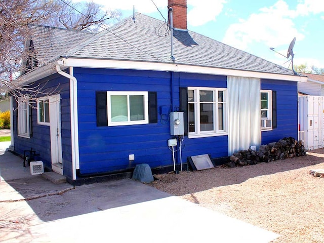 291 E 300 N Unit A, Heber City, UT 84032 - view of front facade featuring roof with shingles and a chimney