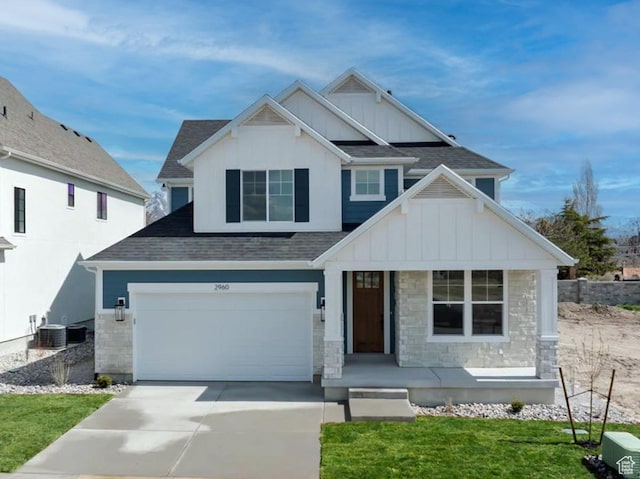 2960 N 1080 W, Lehi, UT 84043 - view of front of home with board and batten siding, roof with shingles, driveway, and a porch