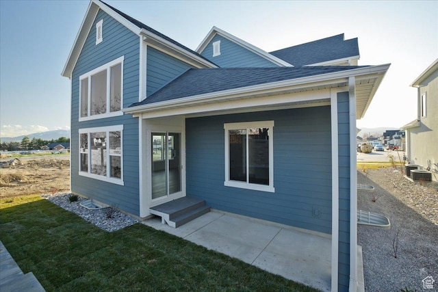 2960 N 1080 W, Lehi, UT 84043 - back of property featuring a shingled roof, a patio area, and a lawn