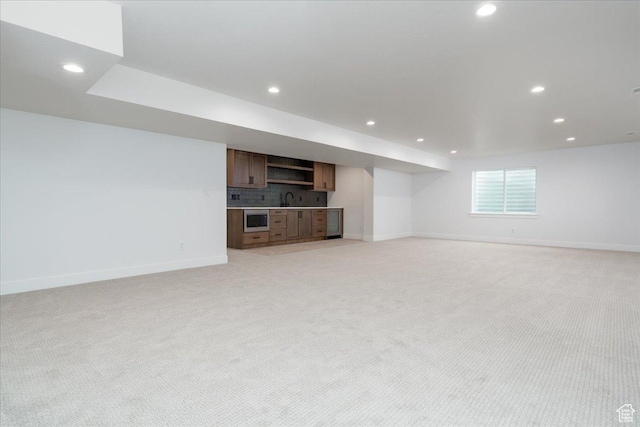 2960 N 1080 W, Lehi, UT 84043 - unfurnished living room featuring light colored carpet, recessed lighting, and wet bar