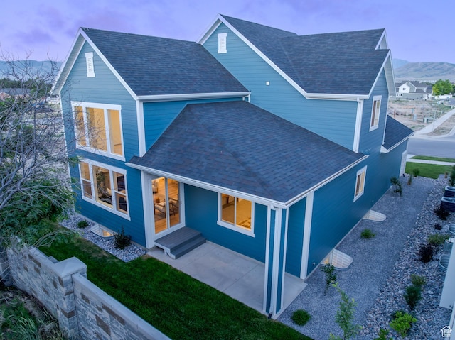 2960 N 1080 W, Lehi, UT 84043 - rear view of house with a shingled roof, a patio, and a yard