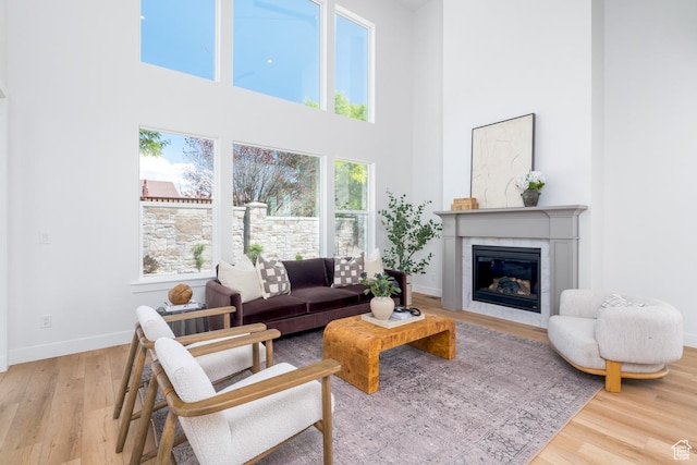 2960 N 1080 W, Lehi, UT 84043 - living area featuring a towering ceiling, a glass covered fireplace, and wood finished floors