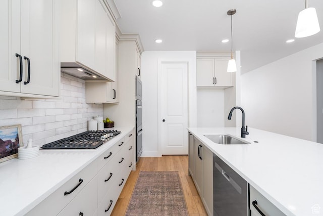 2960 N 1080 W, Lehi, UT 84043 - kitchen featuring stainless steel appliances, light wood finished floors, pendant lighting, tasteful backsplash, and light countertops
