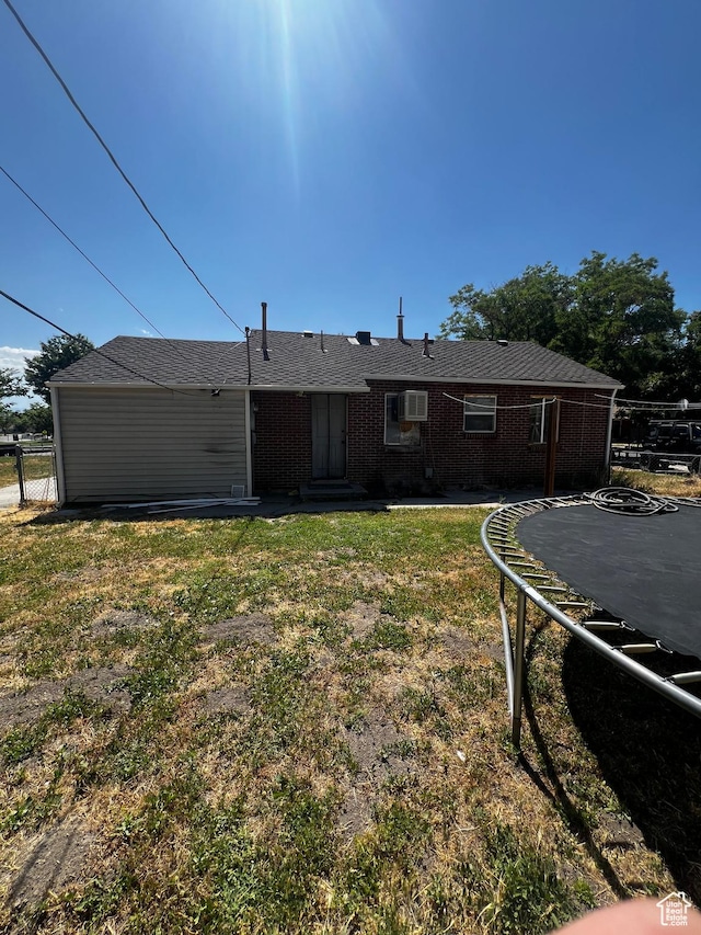 1145 S Navajo St, Salt Lake City, UT 84104 - back of property with a trampoline and brick siding