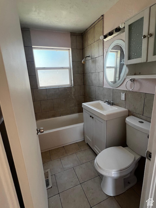 1145 S Navajo St, Salt Lake City, UT 84104 - full bathroom with vanity, tile walls, tile patterned flooring, a textured ceiling, and tub / shower combination