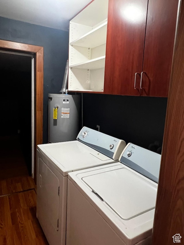 1145 S Navajo St, Salt Lake City, UT 84104 - laundry room featuring separate washer and dryer, water heater, dark wood-type flooring, and cabinet space