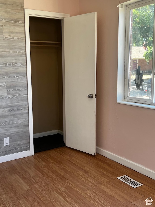 1145 S Navajo St, Salt Lake City, UT 84104 - unfurnished bedroom with wood finished floors and a closet