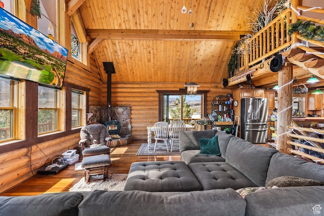 214 W Shinarump Cir, Leeds, UT 84746 - living room with rustic walls, high vaulted ceiling, wood-type flooring, a wood stove, and a wooden ceiling with exposed beams