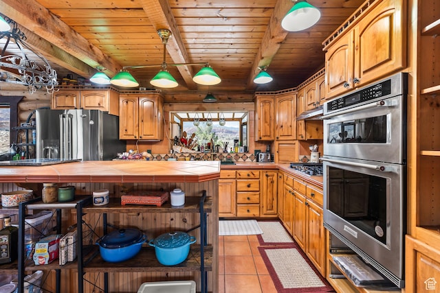 214 W Shinarump Cir, Leeds, UT 84746 - kitchen featuring stainless steel appliances, a wood ceiling with exposed beams, tile counters, healthy amount of natural light, and light tile patterned floors