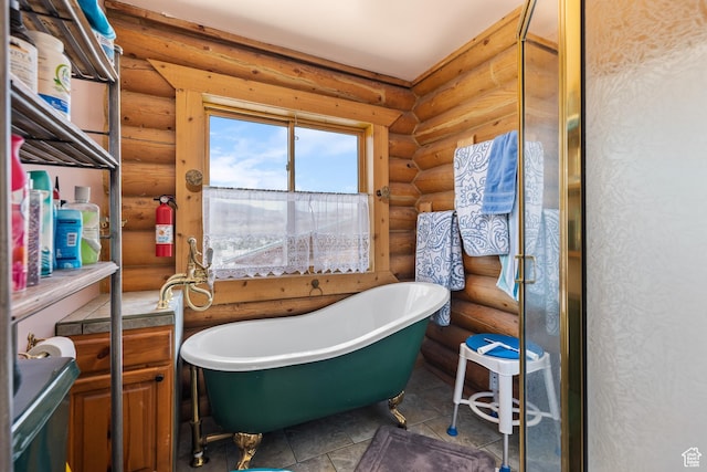 214 W Shinarump Cir, Leeds, UT 84746 - full bath featuring rustic walls, a freestanding tub, and tile patterned floors
