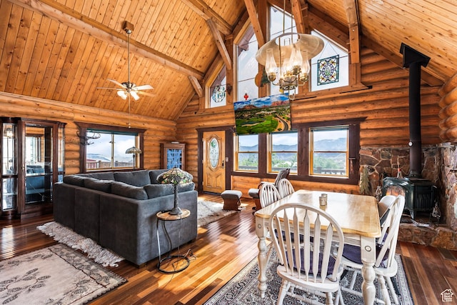 214 W Shinarump Cir, Leeds, UT 84746 - dining space with a wood stove, high vaulted ceiling, rustic walls, a wood ceiling with exposed beams, and hardwood / wood-style flooring