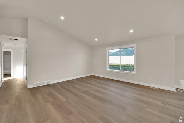 1182 N Berra Blvd, Tooele, UT 84074 - spare room with lofted ceiling, wood finished floors, and recessed lighting