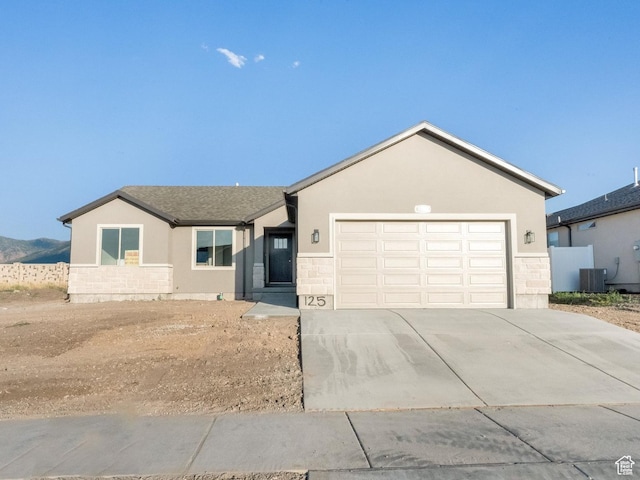 1182 N Berra Blvd, Tooele, UT 84074 - single story home featuring stucco siding, stone siding, driveway, and an attached garage