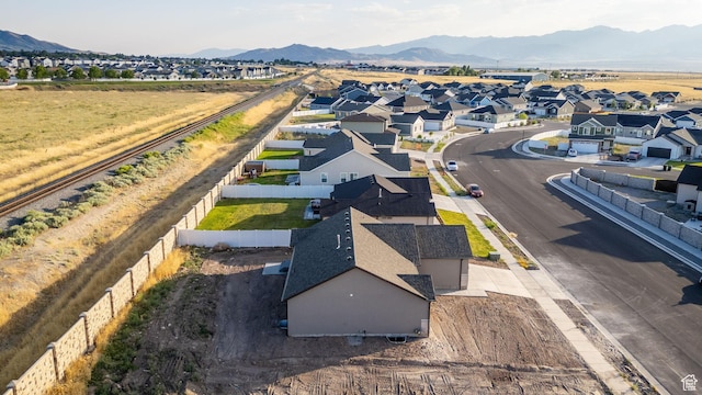 1182 N Berra Blvd, Tooele, UT 84074 - aerial view of residential area with a mountain backdrop