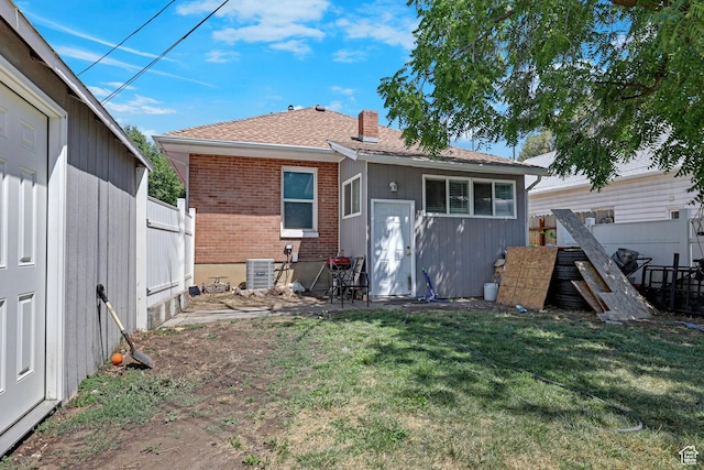 2217 Monroe Blvd, Ogden, UT 84401 - back of house featuring brick siding and a shingled roof