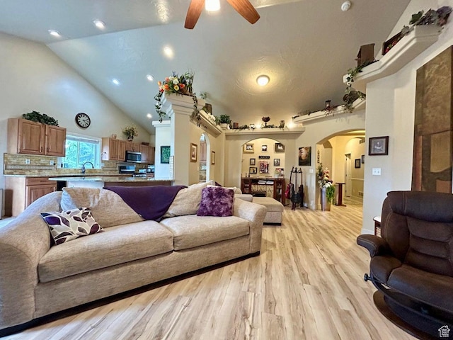 4140 W 975 S, Cedar City, UT 84720 - living room with a ceiling fan, arched walkways, light wood finished floors, high vaulted ceiling, and recessed lighting