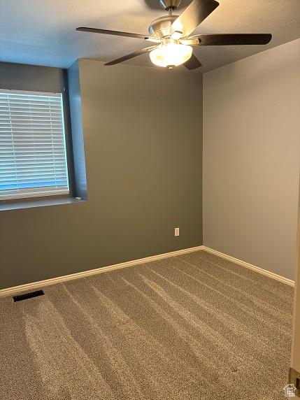 1579 W 2050 N, Clinton, UT 84015 - unfurnished room featuring a ceiling fan and carpet flooring