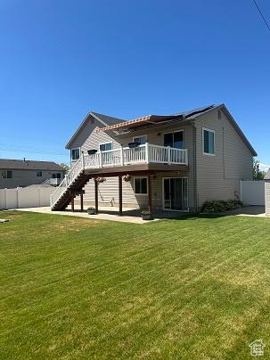1579 W 2050 N, Clinton, UT 84015 - rear view of property featuring a wooden deck, stairway, and a garage