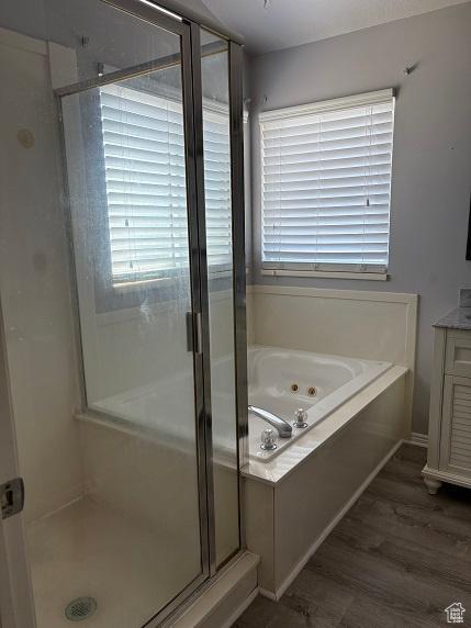 1579 W 2050 N, Clinton, UT 84015 - bathroom featuring a tub with jets, a stall shower, vanity, and wood finished floors