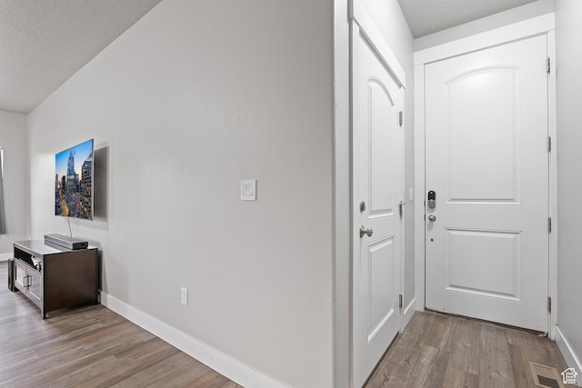 8687 N Oakmont Aly, Eagle Mountain, UT 84005 - hallway featuring wood finished floors and a textured ceiling