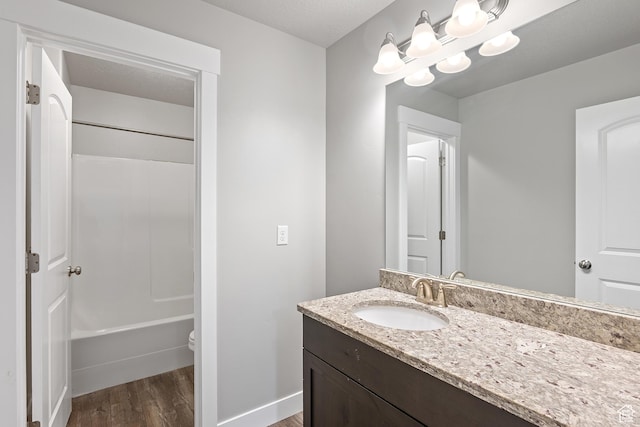 8687 N Oakmont Aly, Eagle Mountain, UT 84005 - full bathroom featuring vanity, wood finished floors, and shower / bath combination