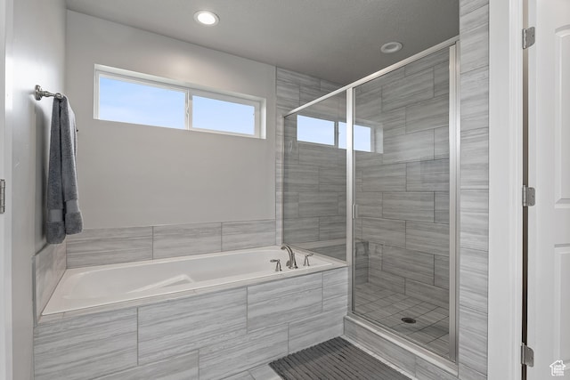 8687 N Oakmont Aly, Eagle Mountain, UT 84005 - full bathroom featuring a garden tub, a stall shower, plenty of natural light, and recessed lighting