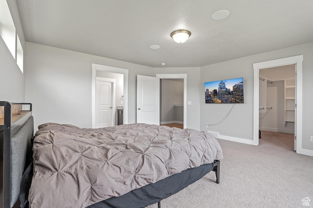 8687 N Oakmont Aly, Eagle Mountain, UT 84005 - carpeted bedroom with baseboards and ensuite bath