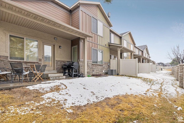 3944 W Sage Blossom Way S, Jordan, UT 84009 - snow covered back of property with board and batten siding and stone siding