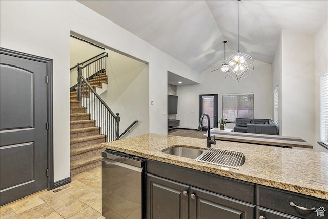 3944 W Sage Blossom Way S, Jordan, UT 84009 - kitchen featuring dishwasher, open floor plan, hanging light fixtures, light stone countertops, and a ceiling fan