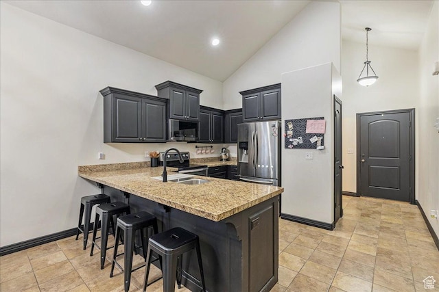 3944 W Sage Blossom Way S, Jordan, UT 84009 - kitchen featuring a peninsula, a breakfast bar area, light countertops, stainless steel appliances, and high vaulted ceiling