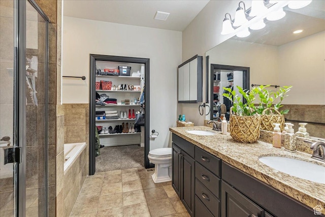 3944 W Sage Blossom Way S, Jordan, UT 84009 - bathroom featuring double vanity, a stall shower, tiled bath, and a chandelier