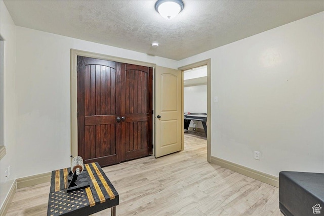 3944 W Sage Blossom Way S, Jordan, UT 84009 - foyer entrance featuring light wood-style floors and a textured ceiling