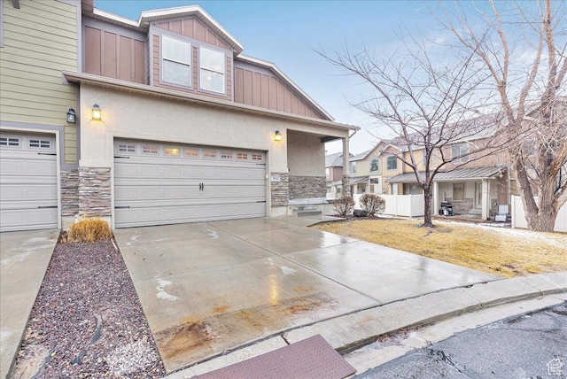 3944 W Sage Blossom Way S, Jordan, UT 84009 - multi unit property featuring stone siding, driveway, an attached garage, and stucco siding