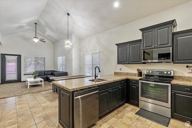 3944 W Sage Blossom Way S, Jordan, UT 84009 - kitchen with stainless steel appliances, a ceiling fan, healthy amount of natural light, a peninsula, and high vaulted ceiling