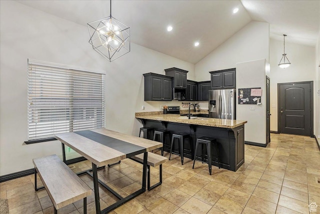 3944 W Sage Blossom Way S, Jordan, UT 84009 - kitchen with stainless steel refrigerator with ice dispenser, high vaulted ceiling, a peninsula, light stone countertops, and a kitchen bar