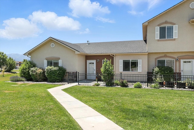 1492 N 565 W Unit 101, Logan, UT 84341 - view of front of house with stucco siding and a shingled roof