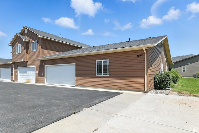 1492 N 565 W Unit 101, Logan, UT 84341 - view of home's exterior with driveway and a garage