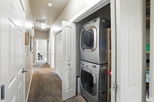 1492 N 565 W Unit 101, Logan, UT 84341 - laundry room with stacked washer / dryer and carpet flooring