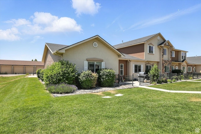 1492 N 565 W Unit 101, Logan, UT 84341 - view of front of house with stucco siding and stone siding