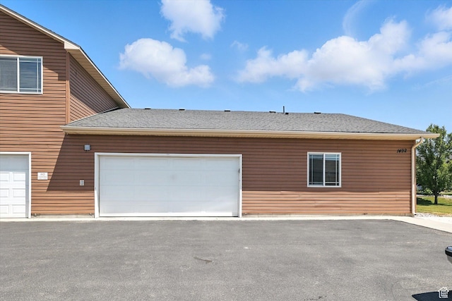 1492 N 565 W Unit 101, Logan, UT 84341 - view of property exterior featuring a shingled roof