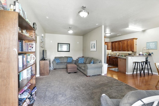 1492 N 565 W Unit 101, Logan, UT 84341 - living room featuring wood finished floors and baseboards