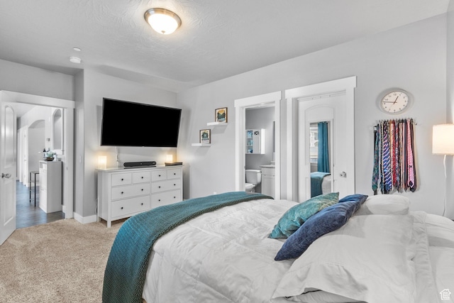 217 W Ridge Rd, Saratoga Springs, UT 84045 - bedroom with carpet flooring, a textured ceiling, and connected bathroom