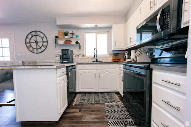 2080 W 2175 S, Syracuse, UT 84075 - kitchen featuring black electric range oven, stainless steel microwave, dishwasher, a kitchen bar, and white cabinetry