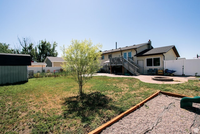 2080 W 2175 S, Syracuse, UT 84075 - fenced backyard with an outdoor fire pit, stairway, a patio area, a deck, and a shed