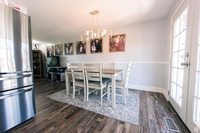 2080 W 2175 S, Syracuse, UT 84075 - dining room featuring healthy amount of natural light, dark wood-type flooring, and a chandelier