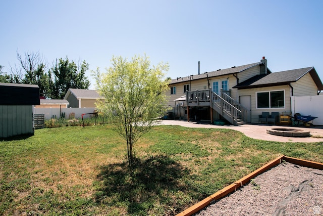 2080 W 2175 S, Syracuse, UT 84075 - fenced backyard with a fire pit, stairs, a patio, a wooden deck, and a shed