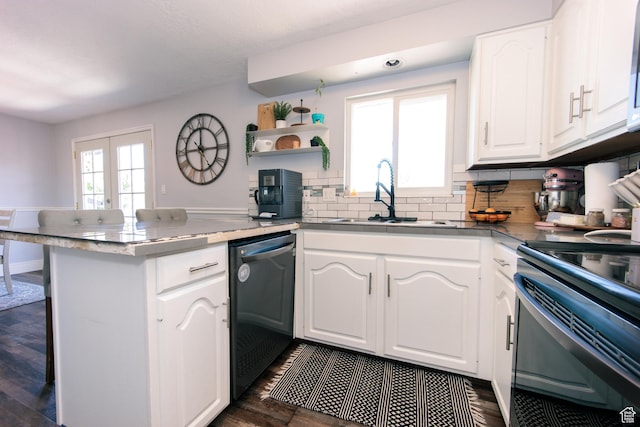2080 W 2175 S, Syracuse, UT 84075 - kitchen featuring dishwasher, a peninsula, white cabinetry, decorative backsplash, and dark wood-type flooring