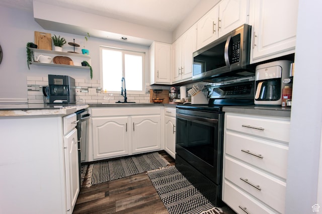 2080 W 2175 S, Syracuse, UT 84075 - kitchen featuring black range with electric cooktop, stainless steel microwave, white cabinetry, open shelves, and dark wood-style floors