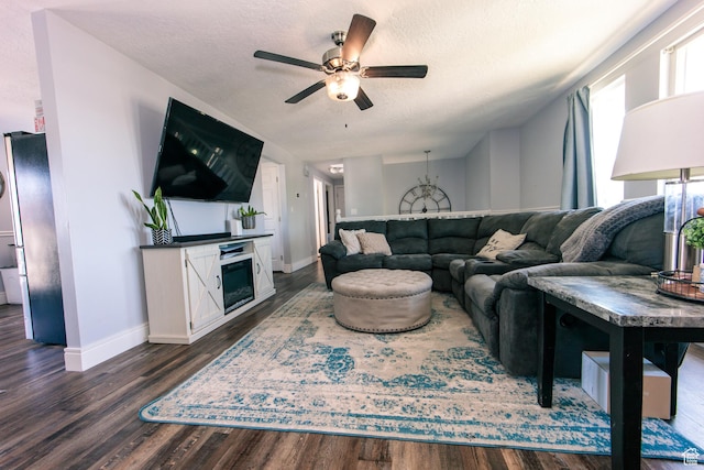 2080 W 2175 S, Syracuse, UT 84075 - living room featuring a ceiling fan, dark wood finished floors, a textured ceiling, and a fireplace